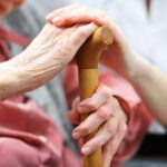 Senior woman with her caregiver at home